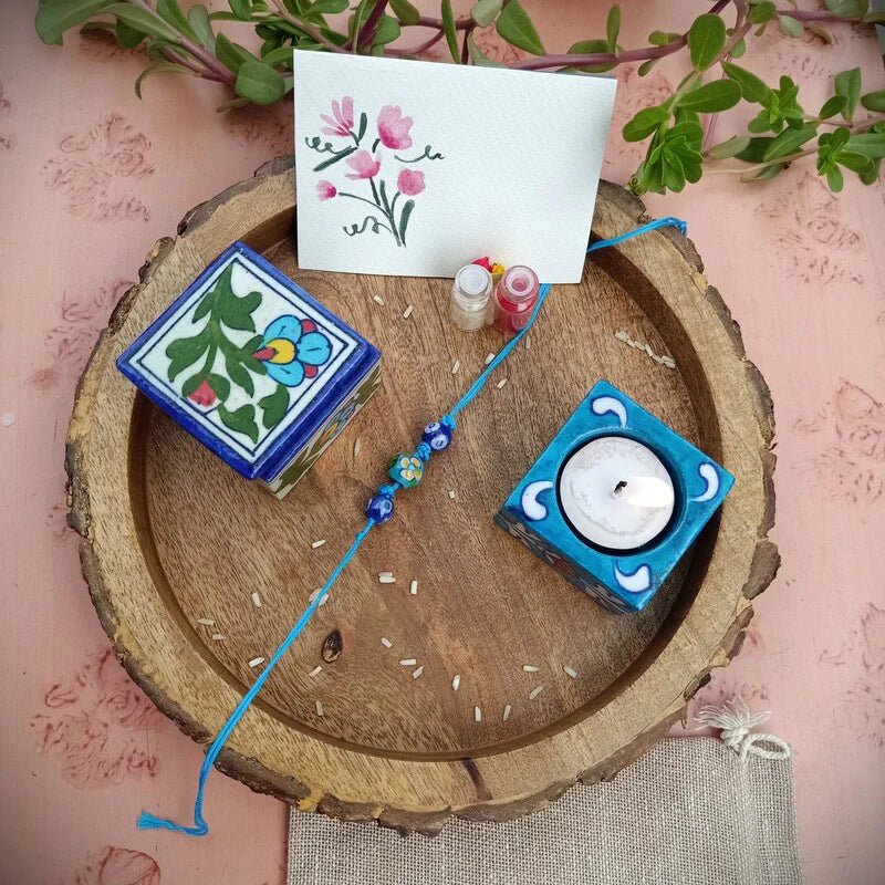 Blue Pottery Bhai Rakhi Gift Hamper – Rakhi by Terracotta by Sachii available on Brown Living™. . SKU: SACHIIRBP003. Img 1.