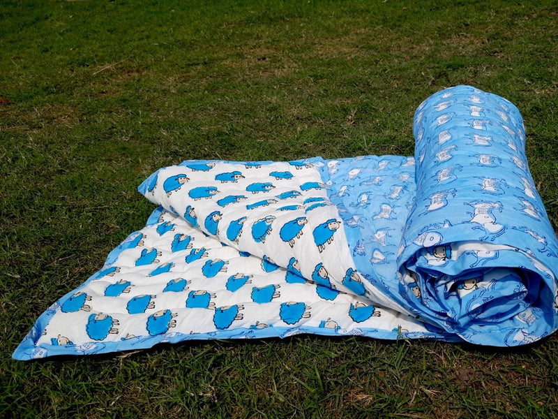 Blue & White Animal Print Kids Handcrafted Quilt | Verified Sustainable Bed Linens on Brown Living™