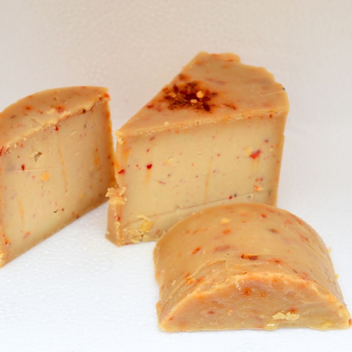 Burnt Red Chilli & Garlic Wheel – Bold Aged Cheese with Spicy Notes – Jams & Spreads on Brown Living™. SKU: HC01RCG. Img 2.
