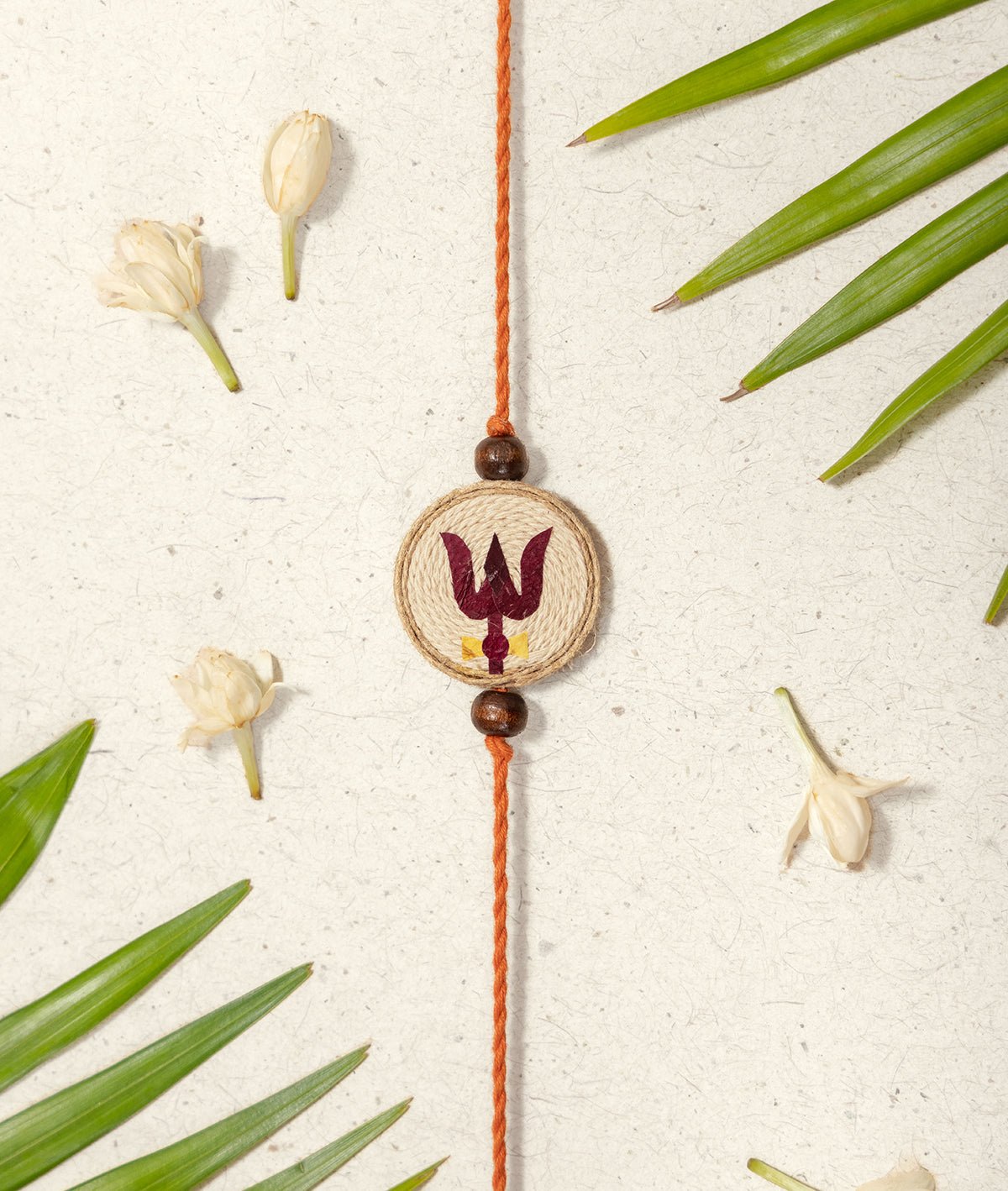 Handmade Traditional Raksha Bandhan Trishul Rakhi – Rakhi on Brown Living™. SKU: GUL-08. Img 1.