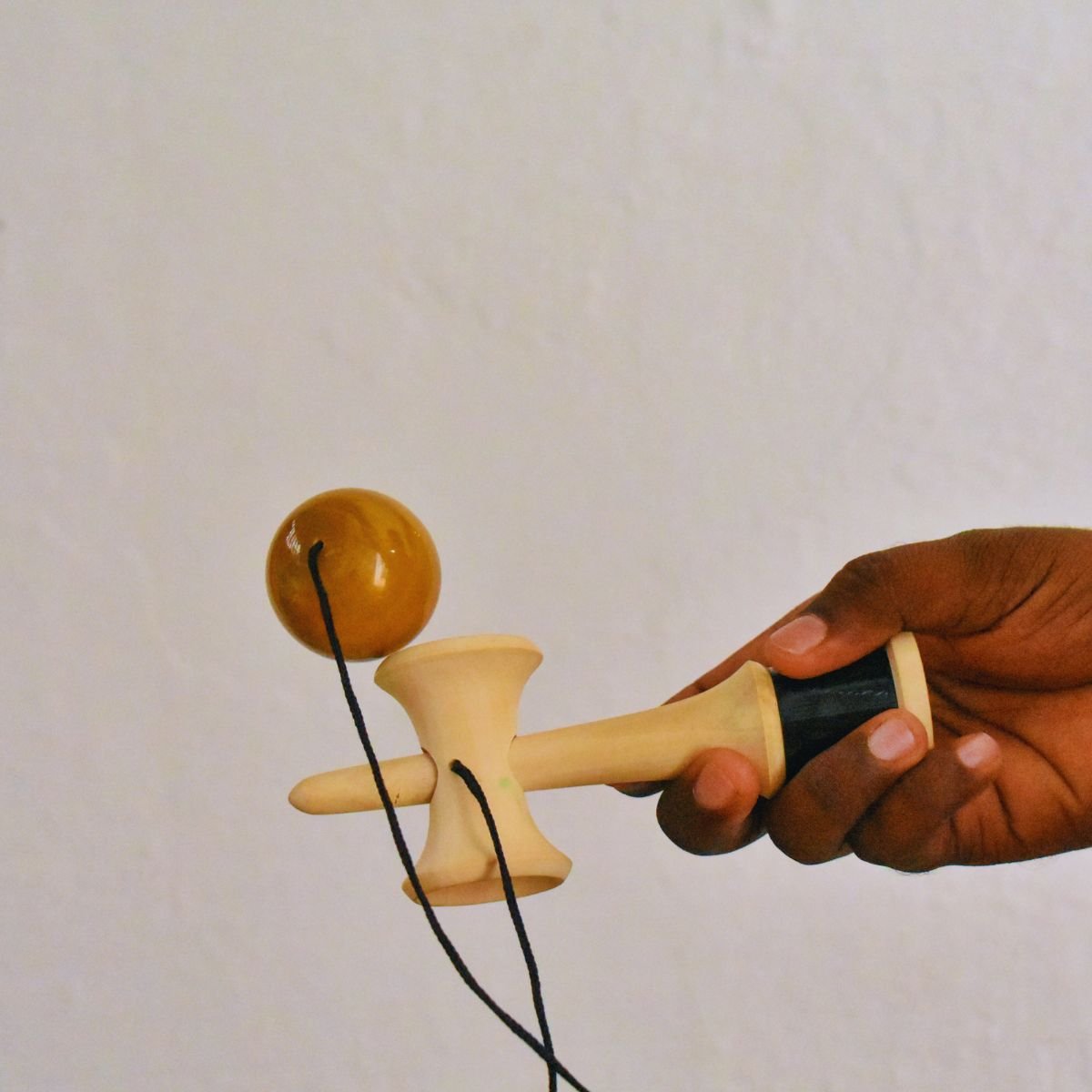 Kendama Toy Yellow | Classic Skill Toy for All Ages – Wooden Toys on Brown Living™. SKU: CD-WOO-KEN-YEL. Img 4.