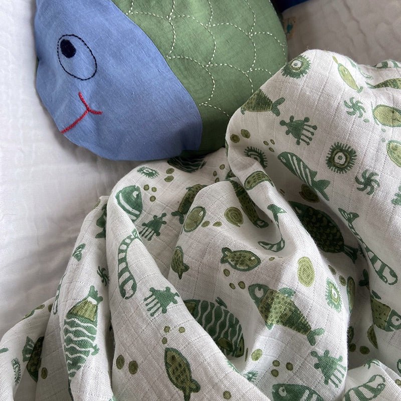 Kids Organic Cotton Koi Mint Swaddle – Baby Swaddle on Brown Living™. SKU: KOI - MNT - SWD. Img 4.