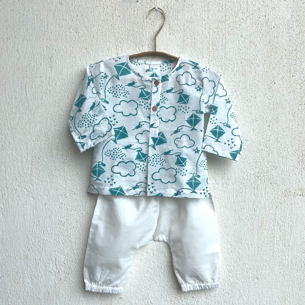 Kids Unisex Organic Cotton Patang Print Teal Kurta Top and White Pants – Kids Daywear Sets on Brown Living™. SKU: PAT - TELWHT - KURPJ - 69. Img 1.