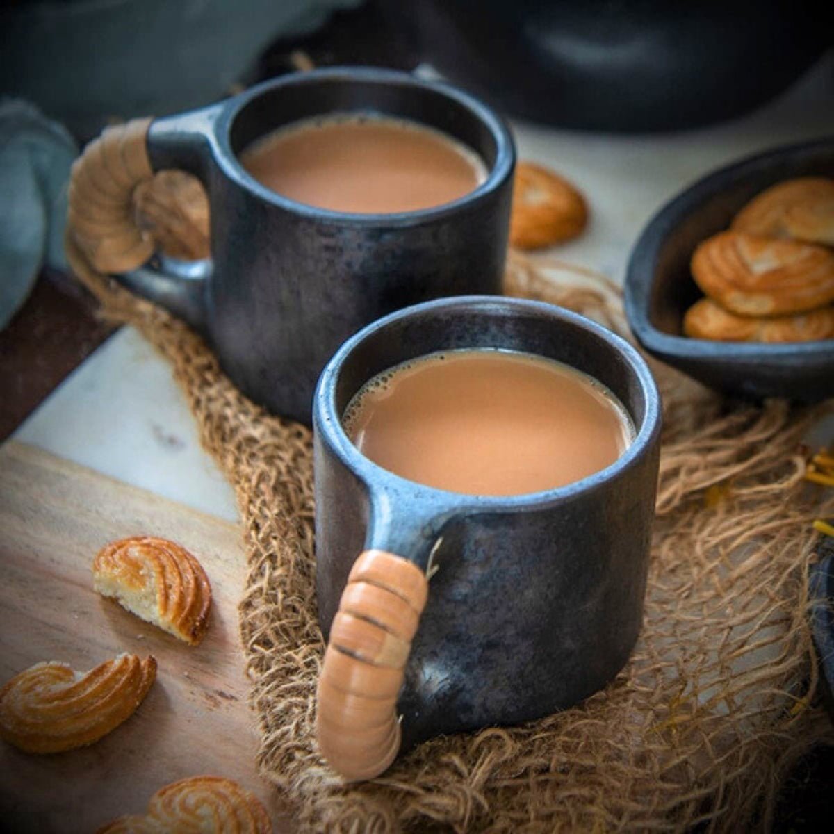 Longpi Black Pottery Tea Cups Pair – Mugs on Brown Living™. SKU: SACHII010. Img 1.