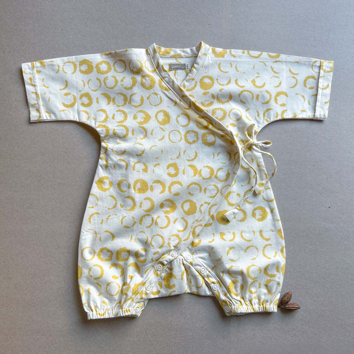Luna Baby Romper – Kids Onesies on Brown Living™. SKU: AGHLUNAROMPOPNB. Img 1.