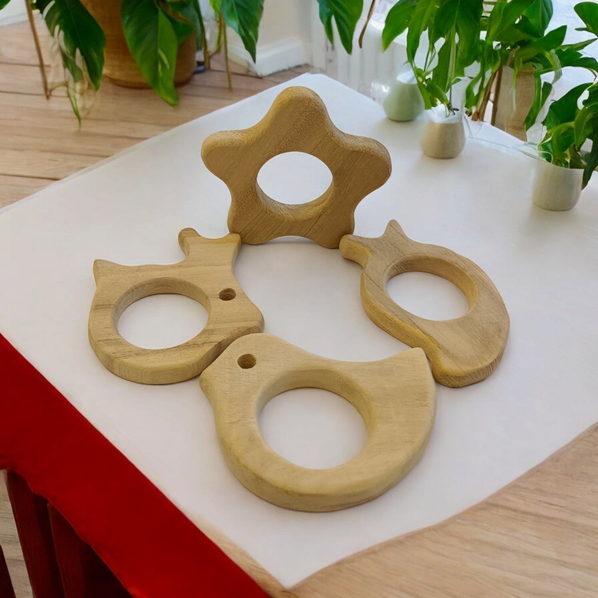 Pack of 4 Neem Wooden Teethers - Rabbit, Flower, Dove & Mango Shapes – Baby Teethers & Soothers on Brown Living™. SKU: T_RBT-FLR-DV-MNG. Img 3.