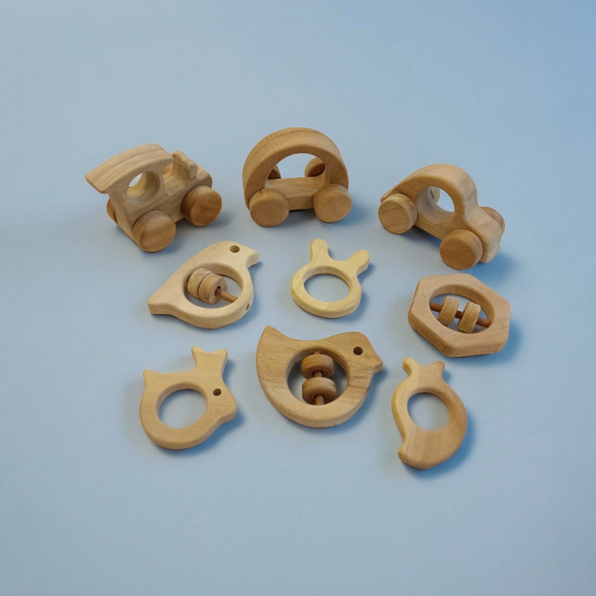 Pack of 9 Neem Wooden Baby Toys | Wheel, Rattle & Teether Set – Wooden Toys on Brown Living™. SKU: WRT_CR-HCR-TRN-DV-SPR-HXN-MNG-RBT-BNY. Img 4.