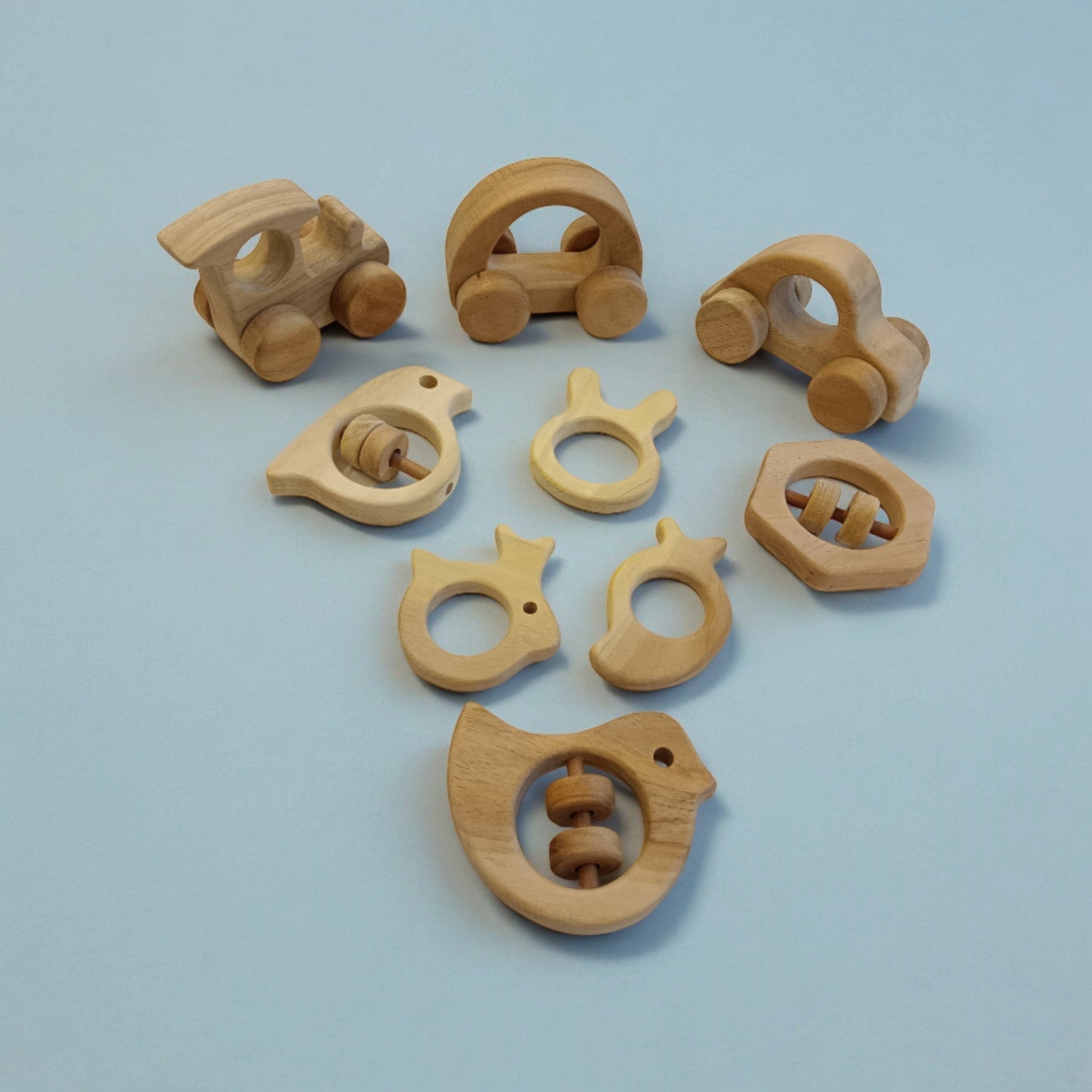 Pack of 9 Neem Wooden Baby Toys | Wheel, Rattle & Teether Set – Wooden Toys on Brown Living™. SKU: WRT_CR-HCR-TRN-DV-SPR-HXN-MNG-RBT-BNY. Img 3.