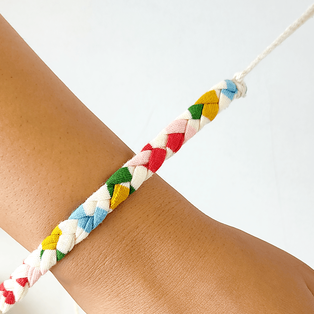Rainbow Upcycled Fabric Rakhi – Rakhi by WEAR EQUAL available on Brown Living™. . SKU: WEFESTIVERAKHI. Img 1.