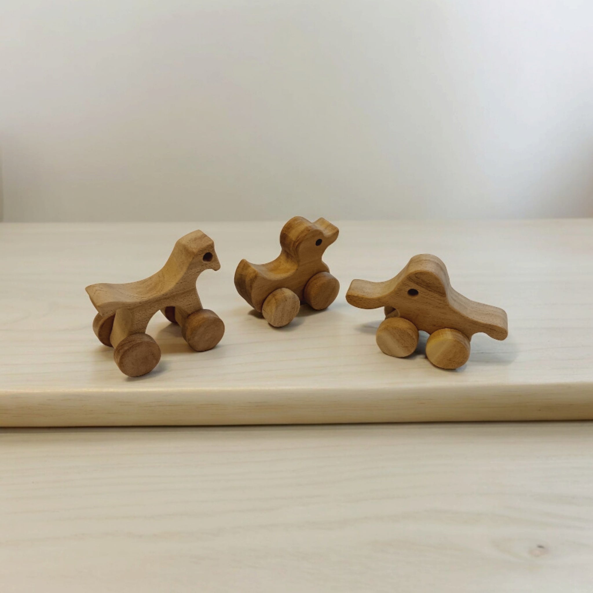 Set Of 3 Neem Wooden Wheel Toys – Horse, Elephant & Duck Shapes – Toy Trains & Vehicles on Brown Living™. SKU: W_HRS-ELP-DK. Img 3.