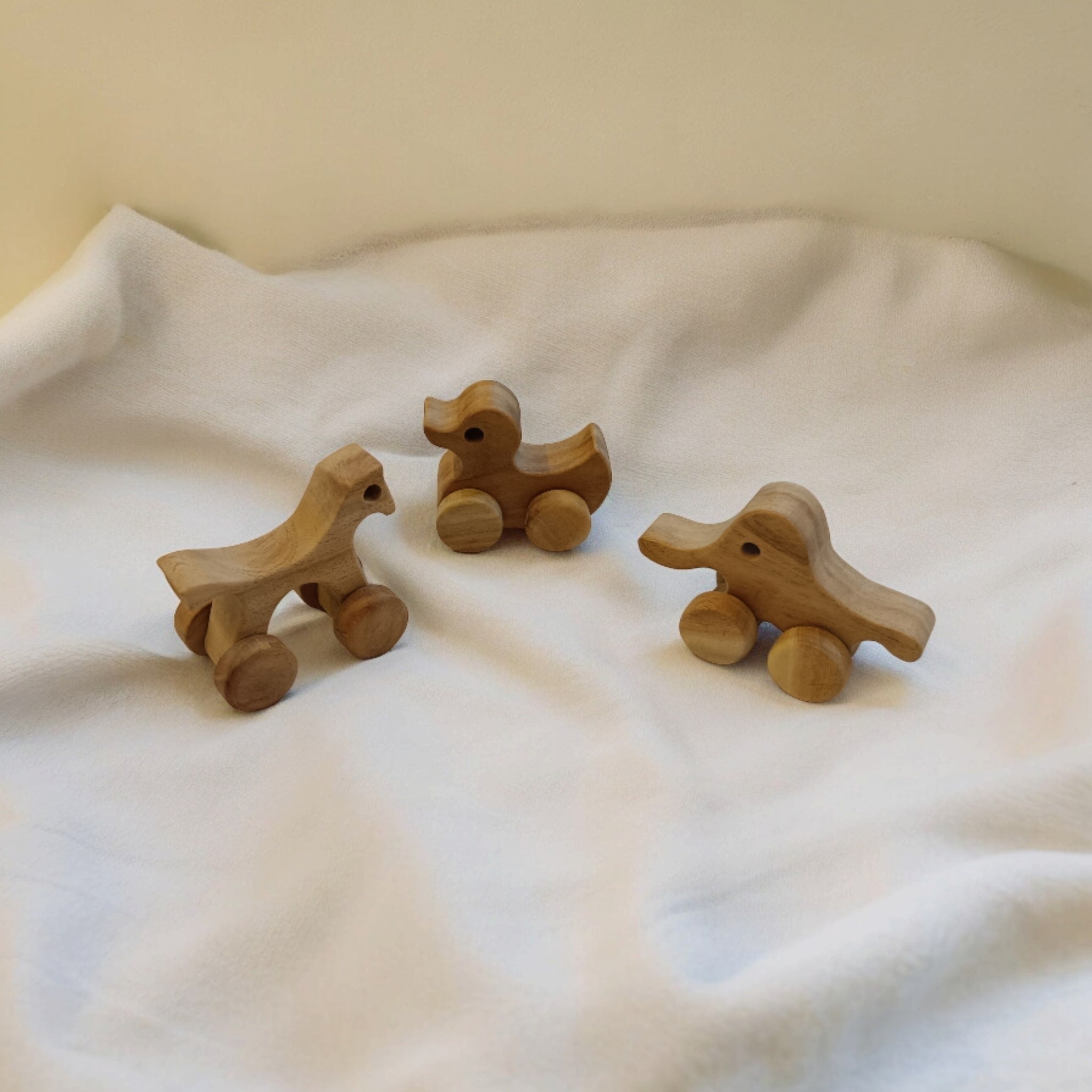 Set Of 3 Neem Wooden Wheel Toys – Horse, Elephant & Duck Shapes – Toy Trains & Vehicles on Brown Living™. SKU: W_HRS-ELP-DK. Img 2.