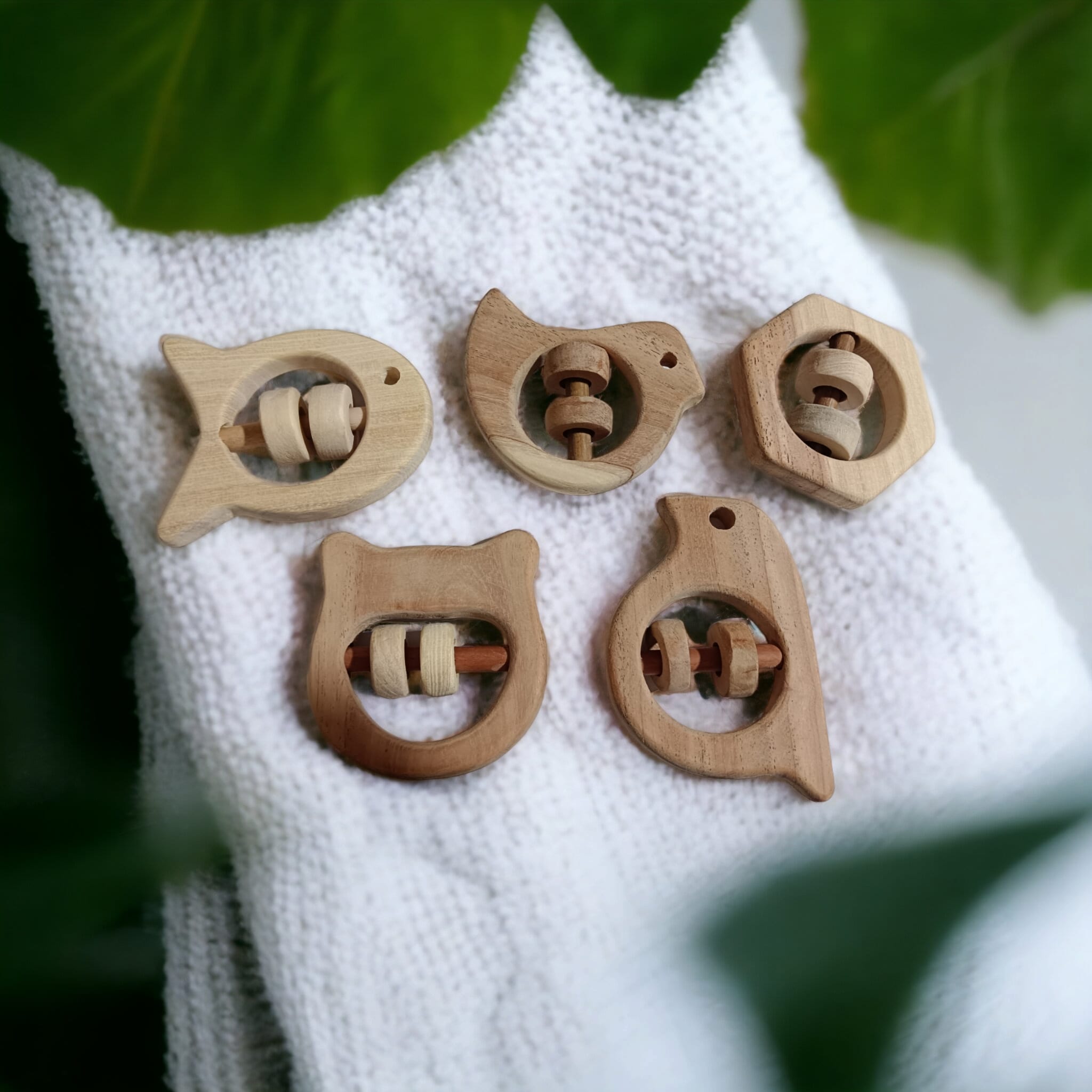 Soundmaking Rattles – Sparrow, Dove, Fish, Hippo & Hexagon Shapes – Baby Rattles on Brown Living™. SKU: R_SET5. Img 4.