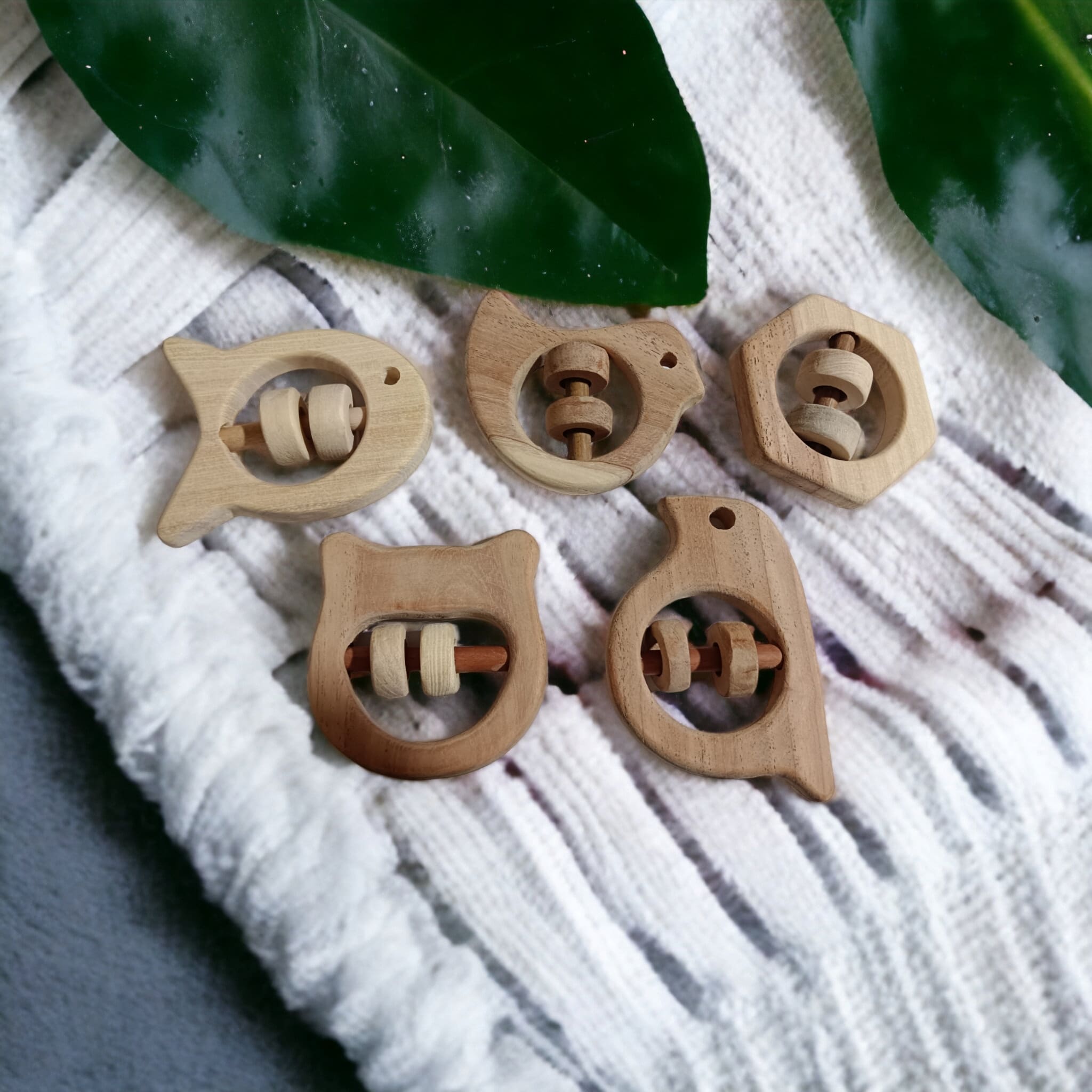 Soundmaking Rattles – Sparrow, Dove, Fish, Hippo & Hexagon Shapes – Baby Rattles on Brown Living™. SKU: R_SET5. Img 5.