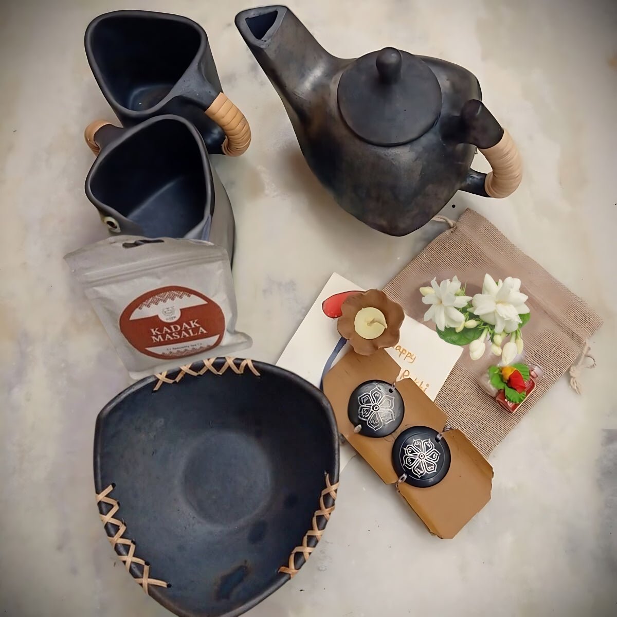 Sustainable Longpi & Nizamabad Black Pottery Luxury Rakhi Gift Hamper – Rakhi by Terracotta by Sachii available on Brown Living™. . SKU: SACHIIRLH001. Img 2.