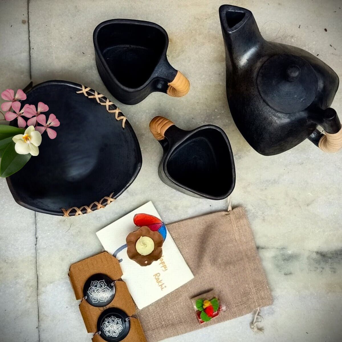 Sustainable Longpi & Nizamabad Black Pottery Luxury Rakhi Gift Hamper – Rakhi by Terracotta by Sachii available on Brown Living™. . SKU: SACHIIRLH001. Img 1.