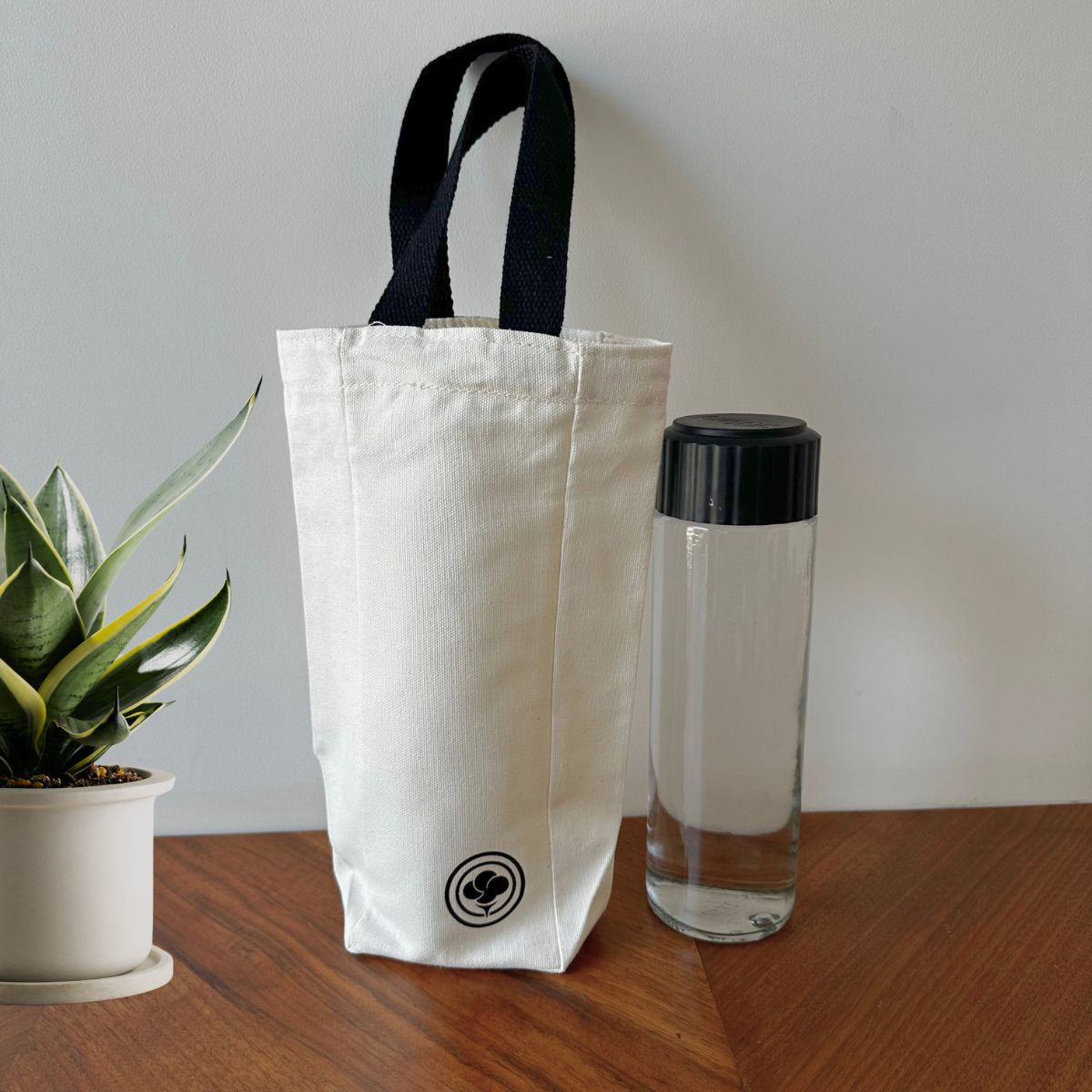 Single Bottle Holder – Eco Carry Pouch for Water Bottles – Tote Bag by The Gossy Shrub available on Brown Living™. White . SKU: SBH001 (WH). Img 1.