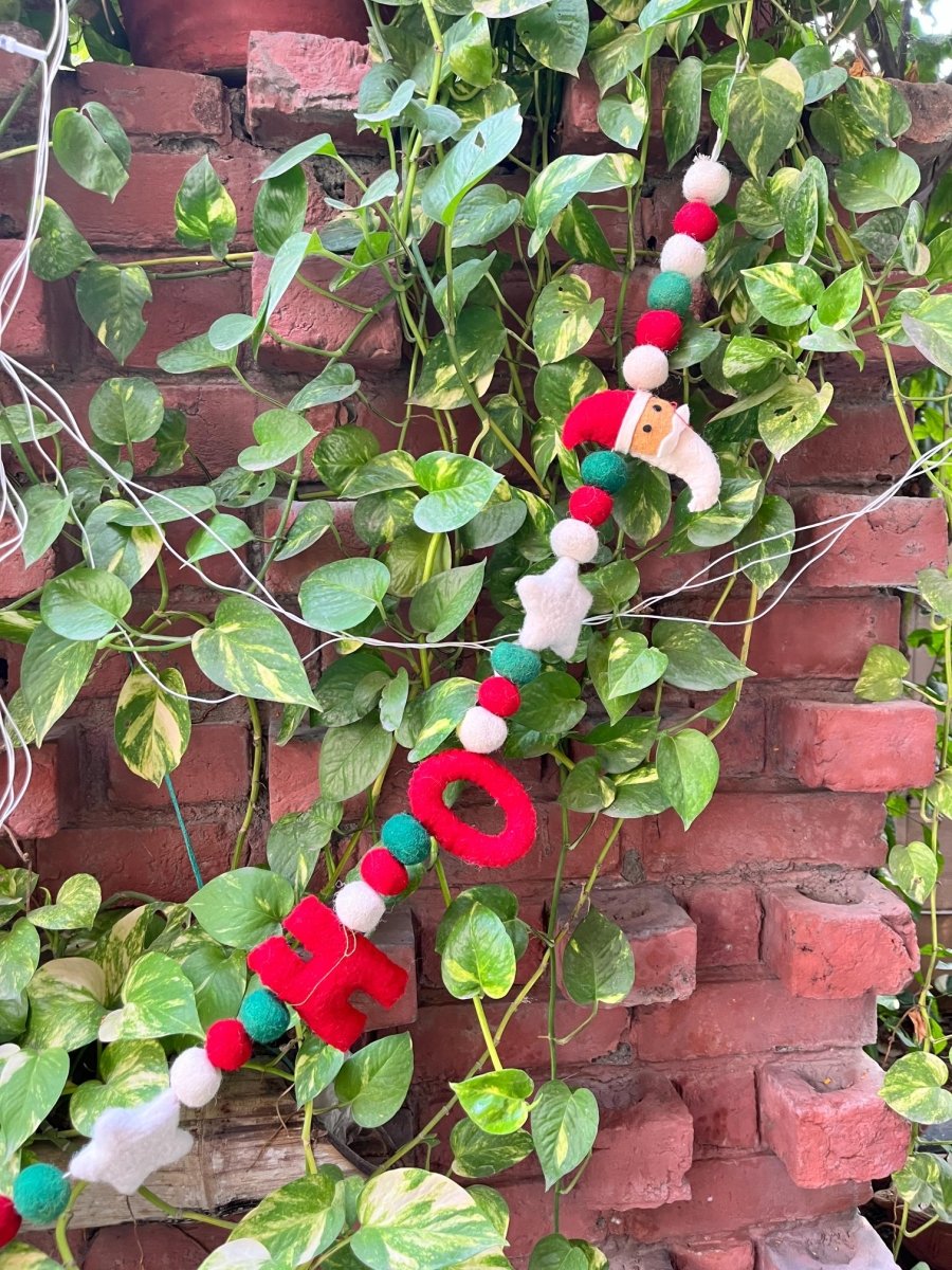 Upcycled Felt Ho - Ho Santa 3d Garland - 72 Inches – Decor & Artefacts on Brown Living™. SKU: SNHO01. Img 2.