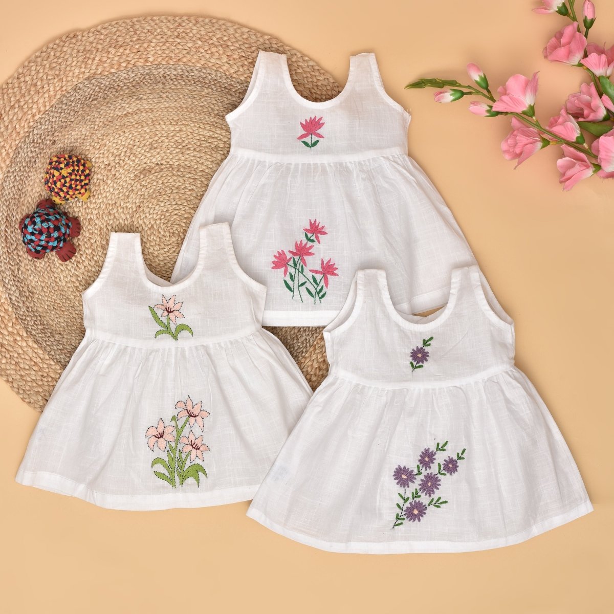 White Pure Cotton Hand Embroidered Baby Dress Combo-Set of 3 by Stotra Brown Living White Pure Cotton Hand Embroidered Baby Dress Combo-Set of 3 by Stotra Brown Living