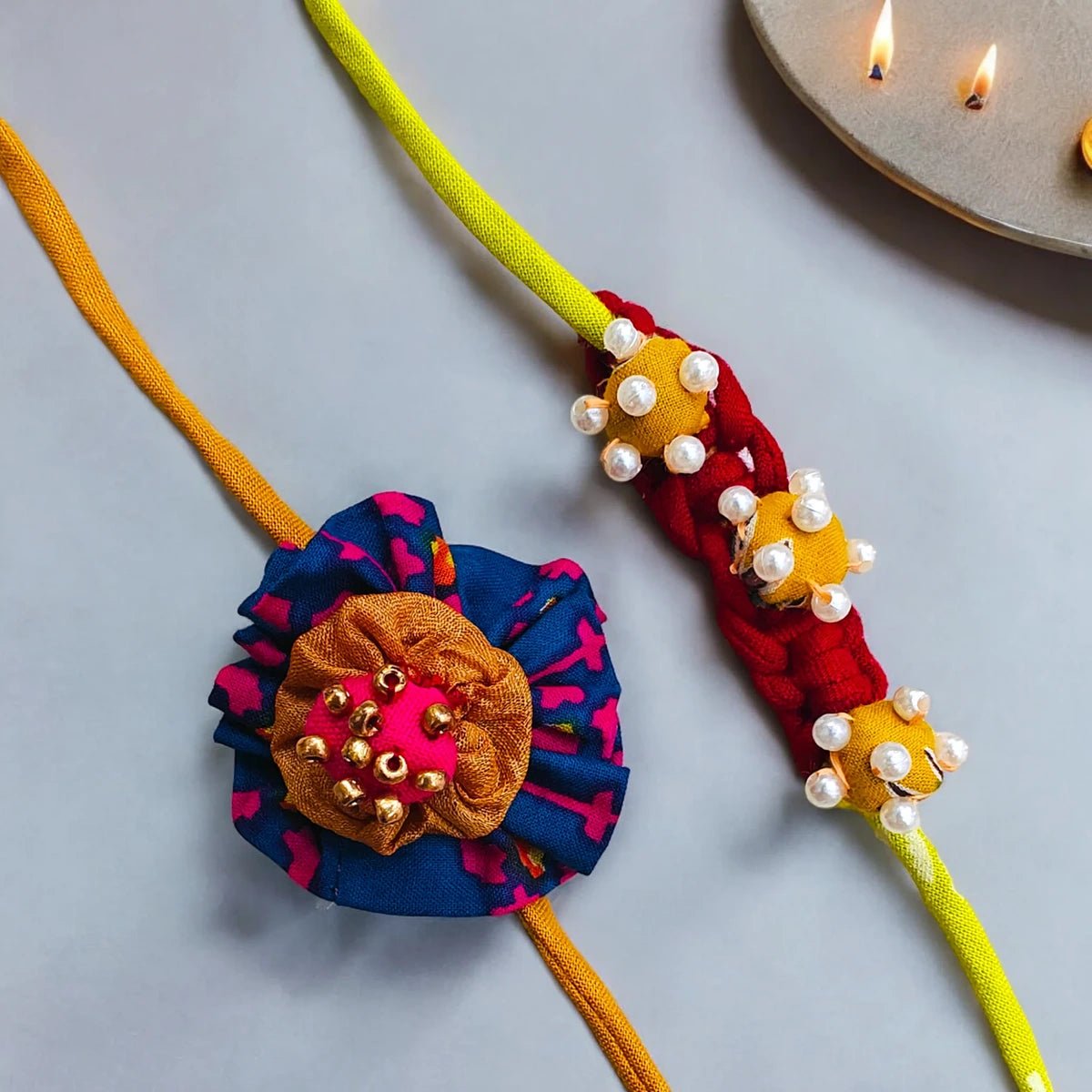 Upcycled Handmade Flower & Bead Rakhi Combo (Pack of 2) – Rakhi by USE ME WORKS available on Brown Living™. . SKU: UMW - Combo - Rakhi - 01. Img 3.