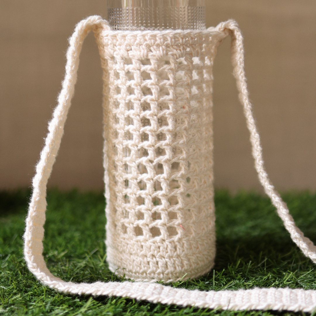 White Handmade Crochet Sling Bottle Cover – Bottles & Sippers by Sarmaya available on Brown Living™. . SKU: SAR109. Img 3.