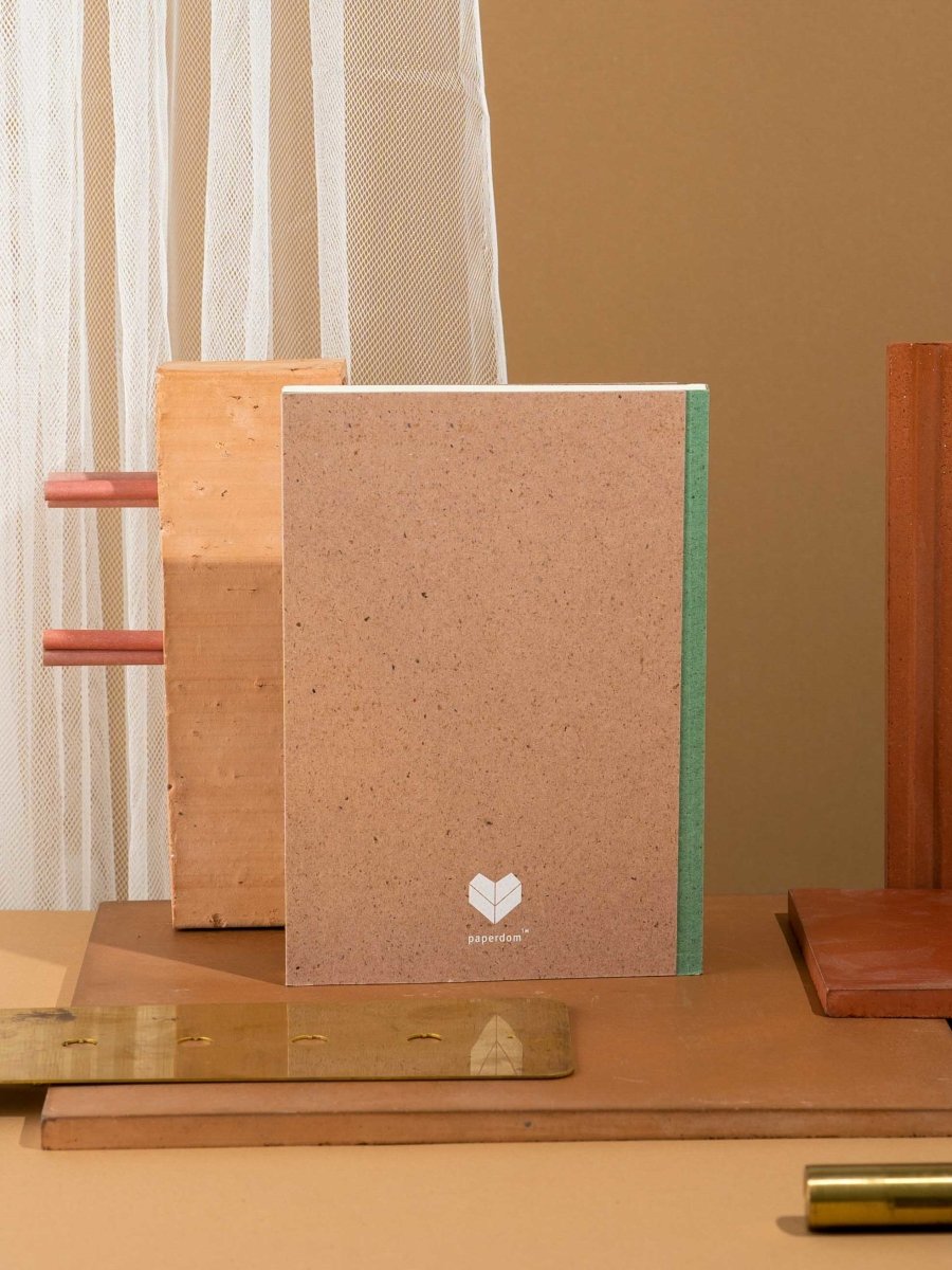 Crossed Gridbook | Perfect bound hard cover, with a built - in envelope pocket at the back | Verified Sustainable by Brown Living™