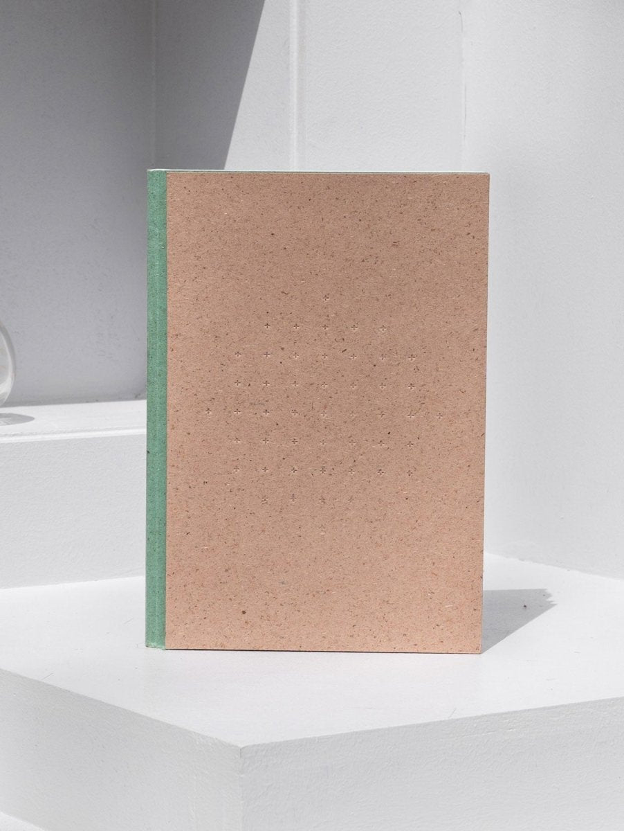 Crossed Gridbook | Perfect bound hard cover, with a built - in envelope pocket at the back | Verified Sustainable by Brown Living™
