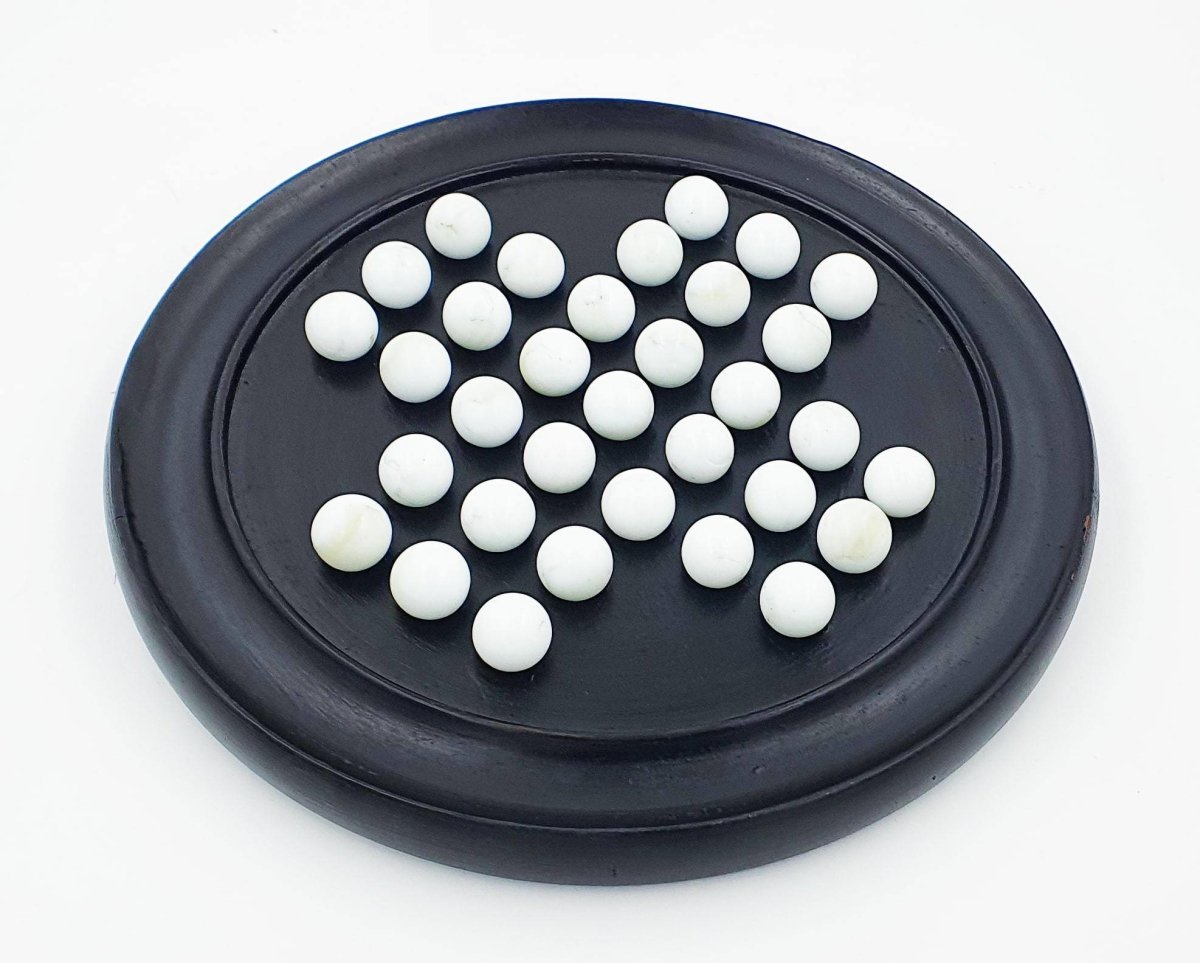 Handmade Wooden Solitaire Board Game with White Glass Marble – Learning & Educational Toys on Brown Living™. SKU: 1007418. Img 5.