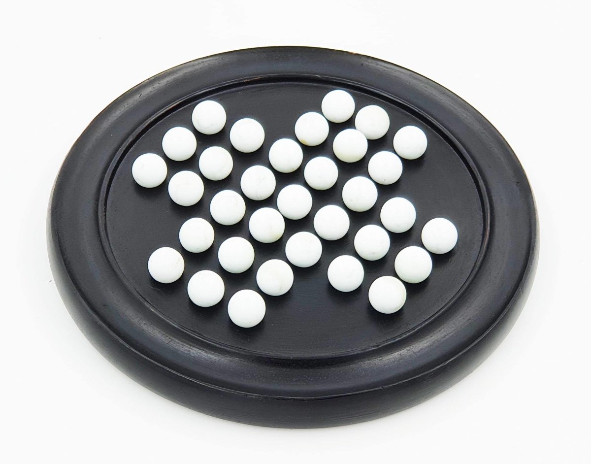 Handmade Wooden Solitaire Board Game with White Glass Marble – Learning & Educational Toys on Brown Living™. SKU: 1007418. Img 1.
