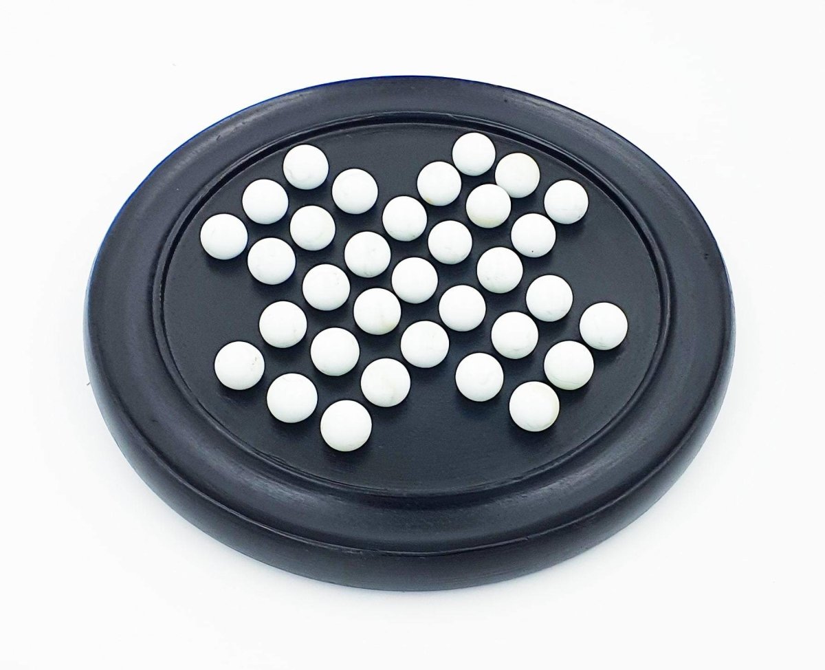 Handmade Wooden Solitaire Board Game with White Glass Marble – Learning & Educational Toys on Brown Living™. SKU: 1007418. Img 2.
