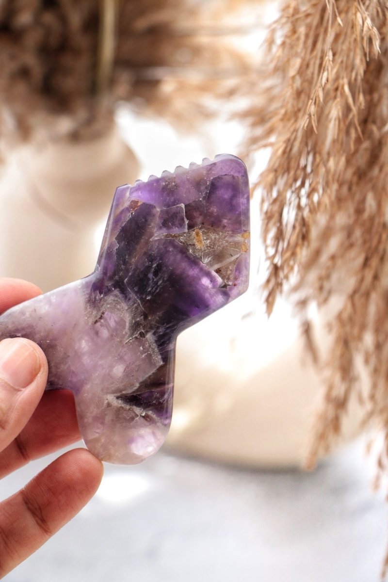 Mini Maestro Amethyst Gua Sha – Massager on Brown Living™. SKU: Lamina - 13. Img 1.