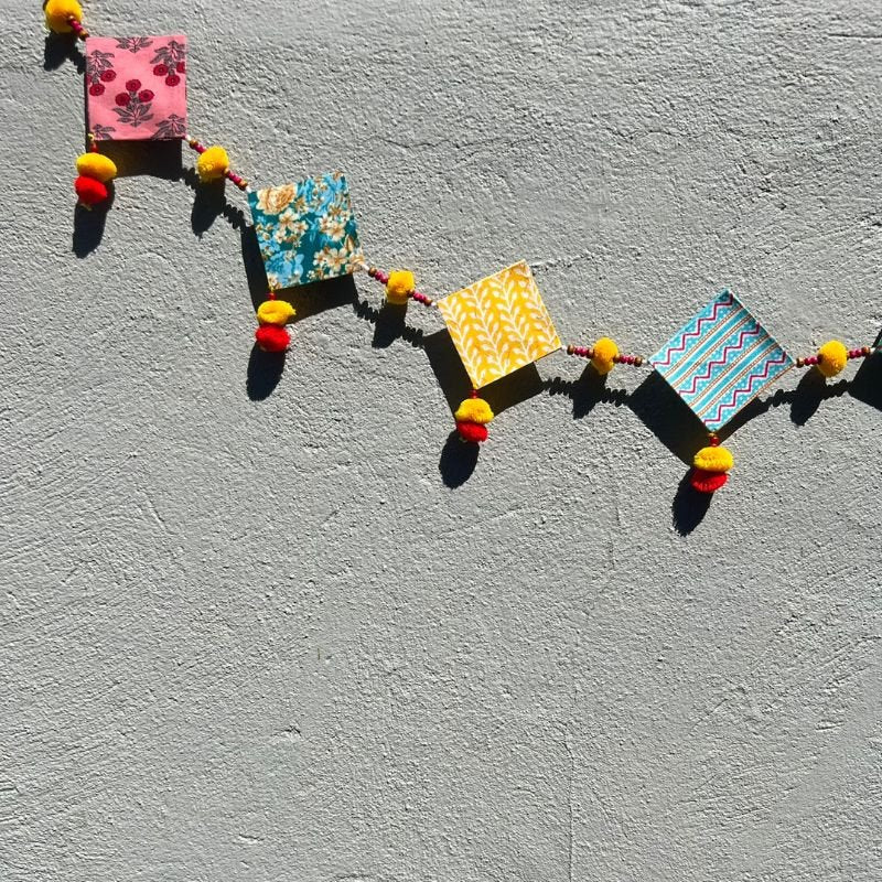 Upcycled Cotton and Newsaper Toran – Wall Decor on Brown Living™. SKU: GRTRN02. Img 4.