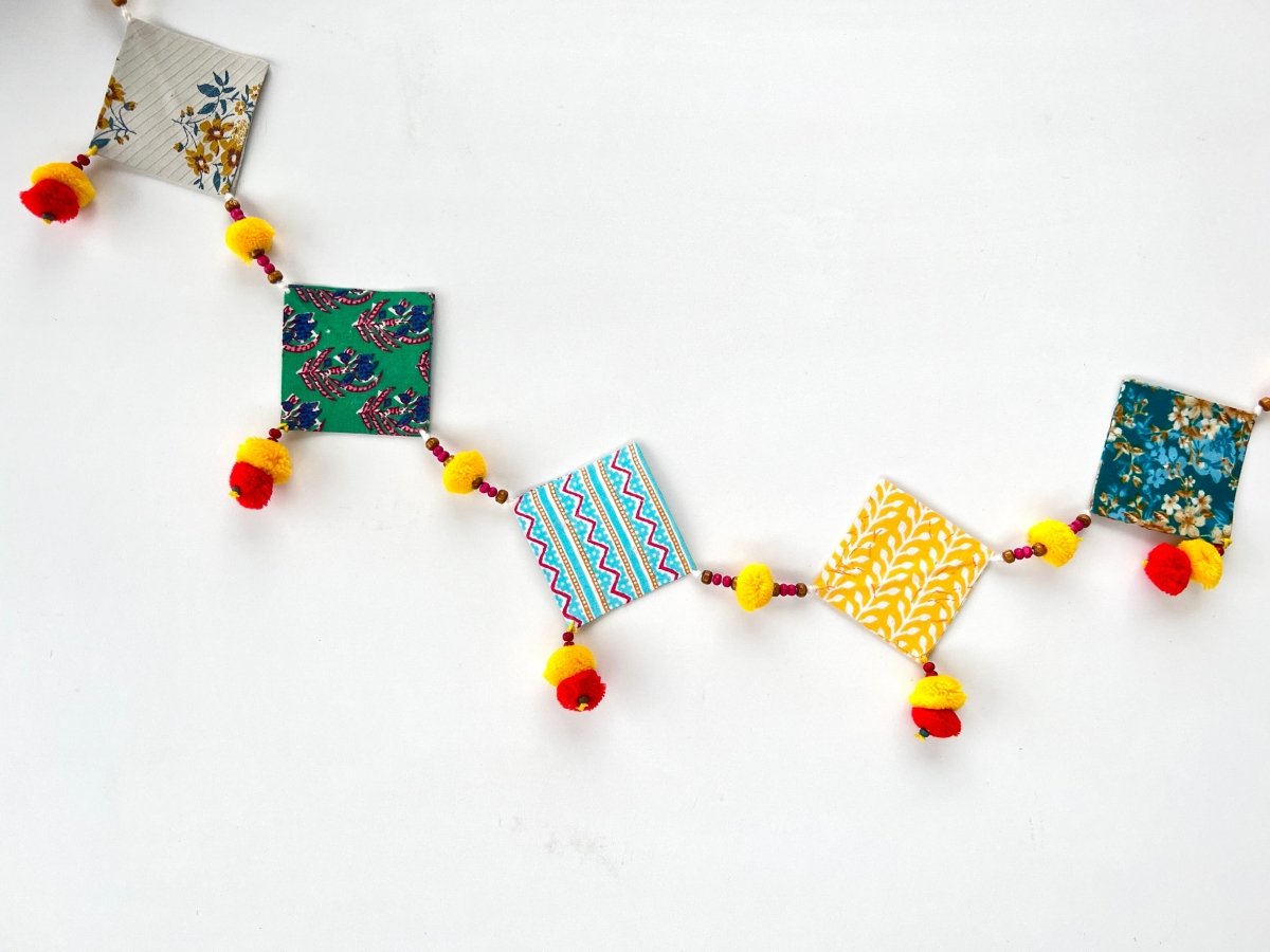 Upcycled Cotton and Newsaper Toran – Wall Decor on Brown Living™. SKU: GRTRN02. Img 2.