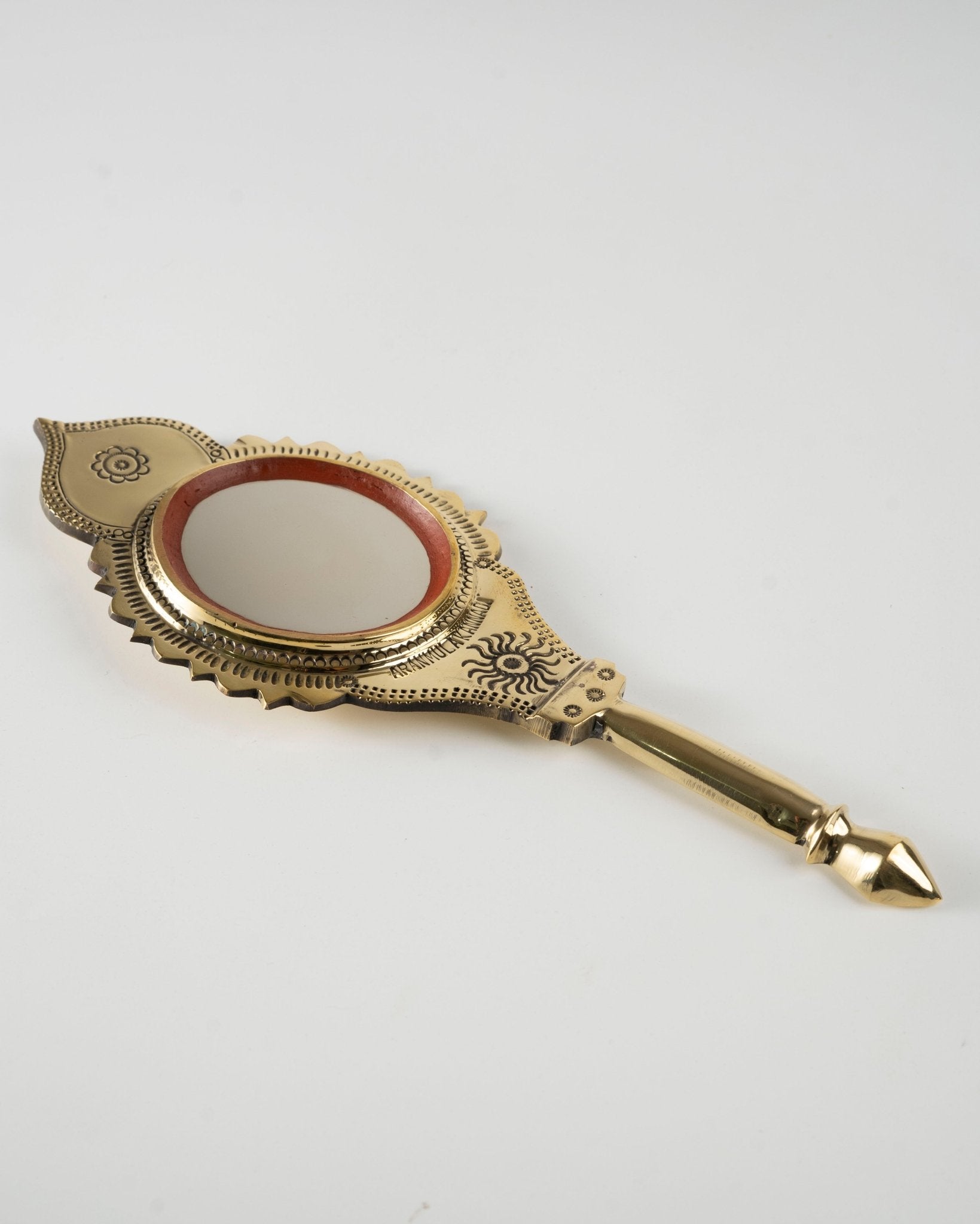 Aranmula Kannadi – Small Travel Friendly Handcrafted Metal Mirror – Home Decor on Brown Living™. SKU: ANTAKMGRHHG. Img 1.