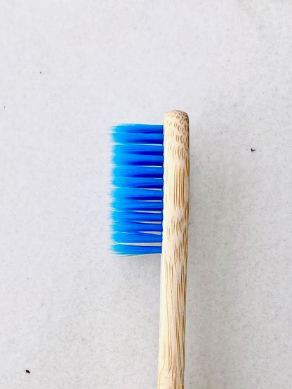 Bamboo Toothbrush with Blue Bristles – Eco - Friendly & Biodegradable – Toothbrush on Brown Living™. SKU: EM0001B. Img 2.