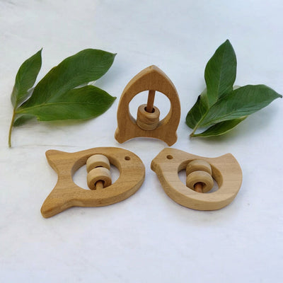 Beautiful Rattle Toys – Dove, Fish & Rocket Shapes For Babies – Baby Rattles on Brown Living™. SKU: R_DV-FSH-RKT. Img 2.