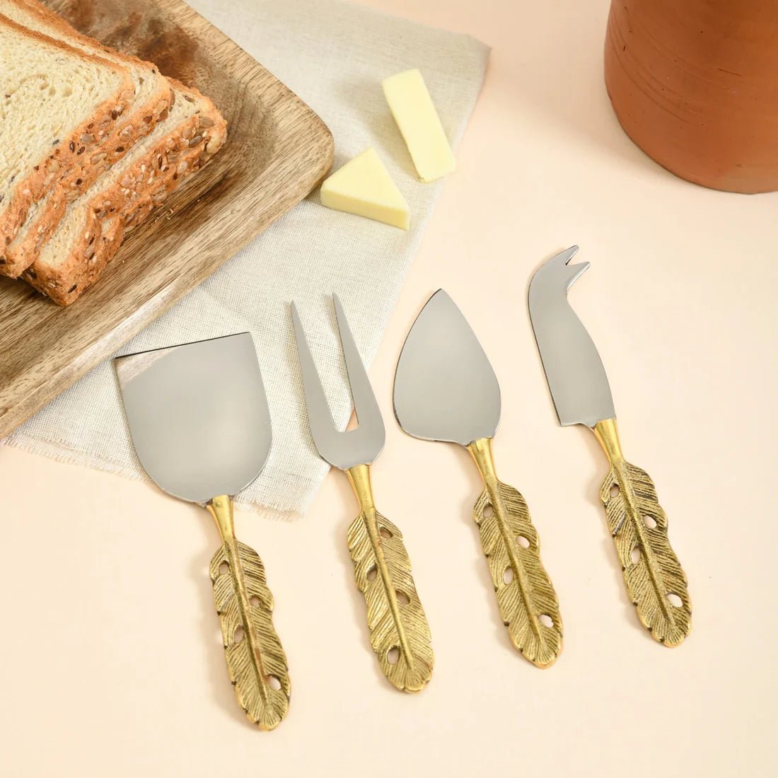 Brass 4 - piece Cheese Knife Set | Punkh - Feather Handle – Kitchen Tools by Pravaah India available on Brown Living™. . SKU: PRA23HD013BL. Img 1.