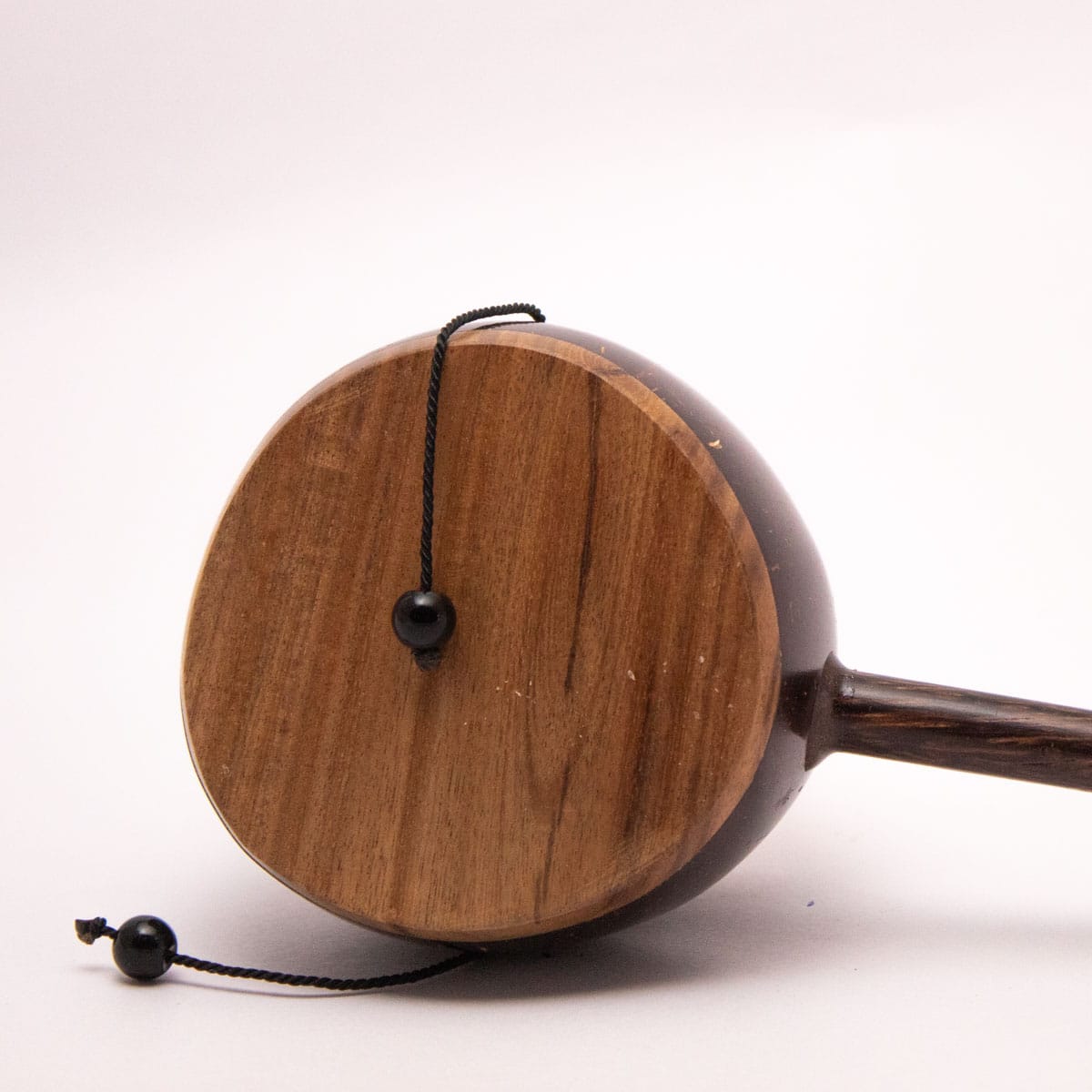 Coconut Shell Kudhukudhuppu – Traditional Musical Toy for Kids – Musical Instruments on Brown Living™. SKU: EGM05. Img 1.