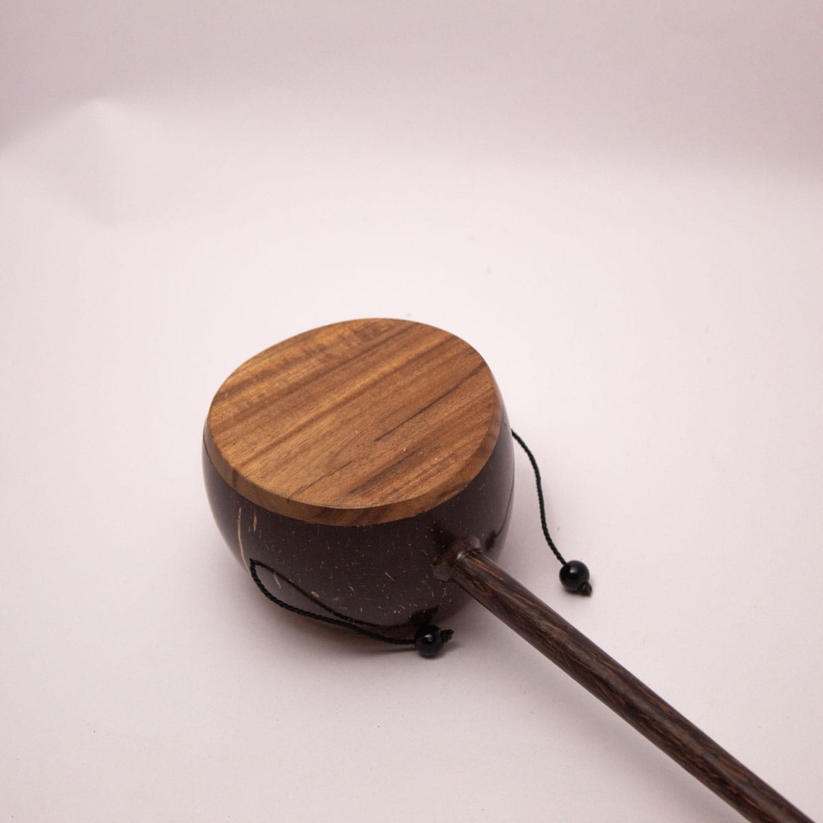 Coconut Shell Kudhukudhuppu – Traditional Musical Toy for Kids – Musical Instruments on Brown Living™. SKU: EGM05. Img 3.