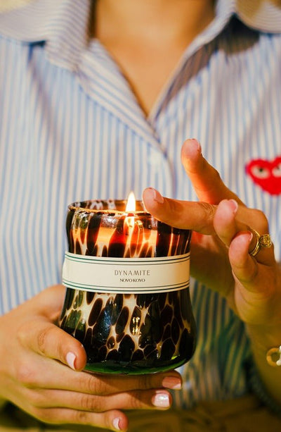 Dynamite Candle | Peachy Punch & Woody Amberwood Scented Soy Candle – Candles & Fragrances on Brown Living™. SKU: DTGC002. Img 1.