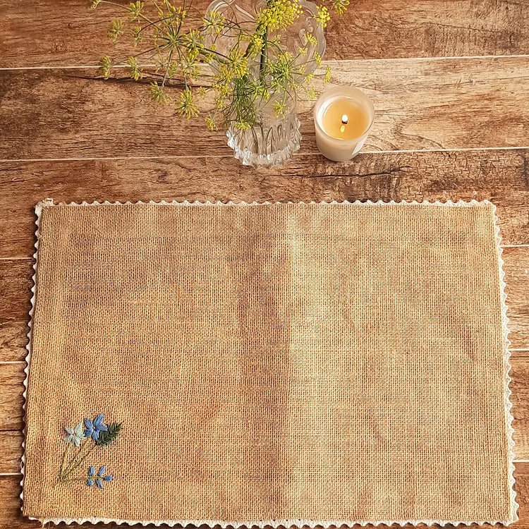 Embroidered Jute Table Mat Forget Me Not (Set of 4) – Home Decor by Studio Vilasita available on Brown Living™. . SKU: MP_JMFMEN4. Img 2.