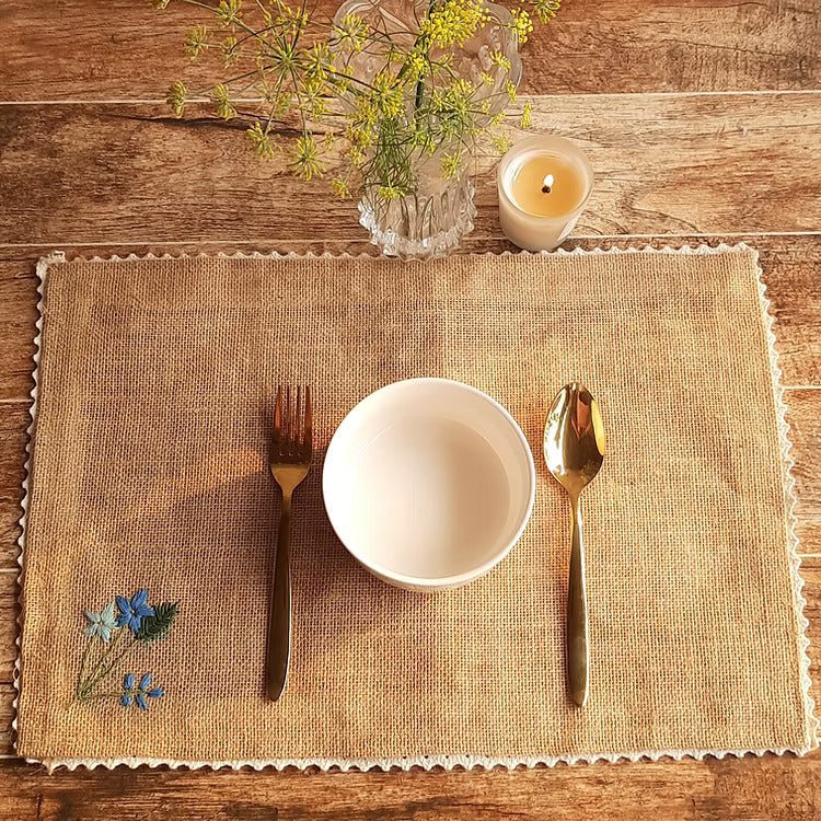 Embroidered Jute Table Mat Forget Me Not (Set of 4) – Home Decor by Studio Vilasita available on Brown Living™. . SKU: MP_JMFMEN4. Img 1.