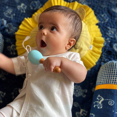 Kids Newborn Gift Set - Organic Cotton Mustard Seed Lion Pillow and Maracas – Gift Giving on Brown Living™. SKU: LON - MAR - BLU. Img 2.