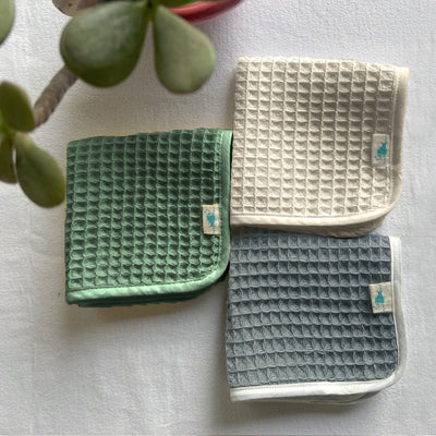 Kids Organic Cotton Handwoven Waffle Washcloths – Kids Travel Accessories on Brown Living™. SKU: WSH SET 3 - GRY - MNT - CRM. Img 2.