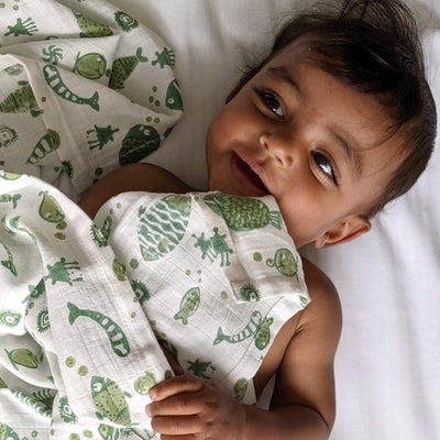 Kids Organic Cotton Koi Mint Swaddle – Baby Swaddle on Brown Living™. SKU: KOI - MNT - SWD. Img 2.