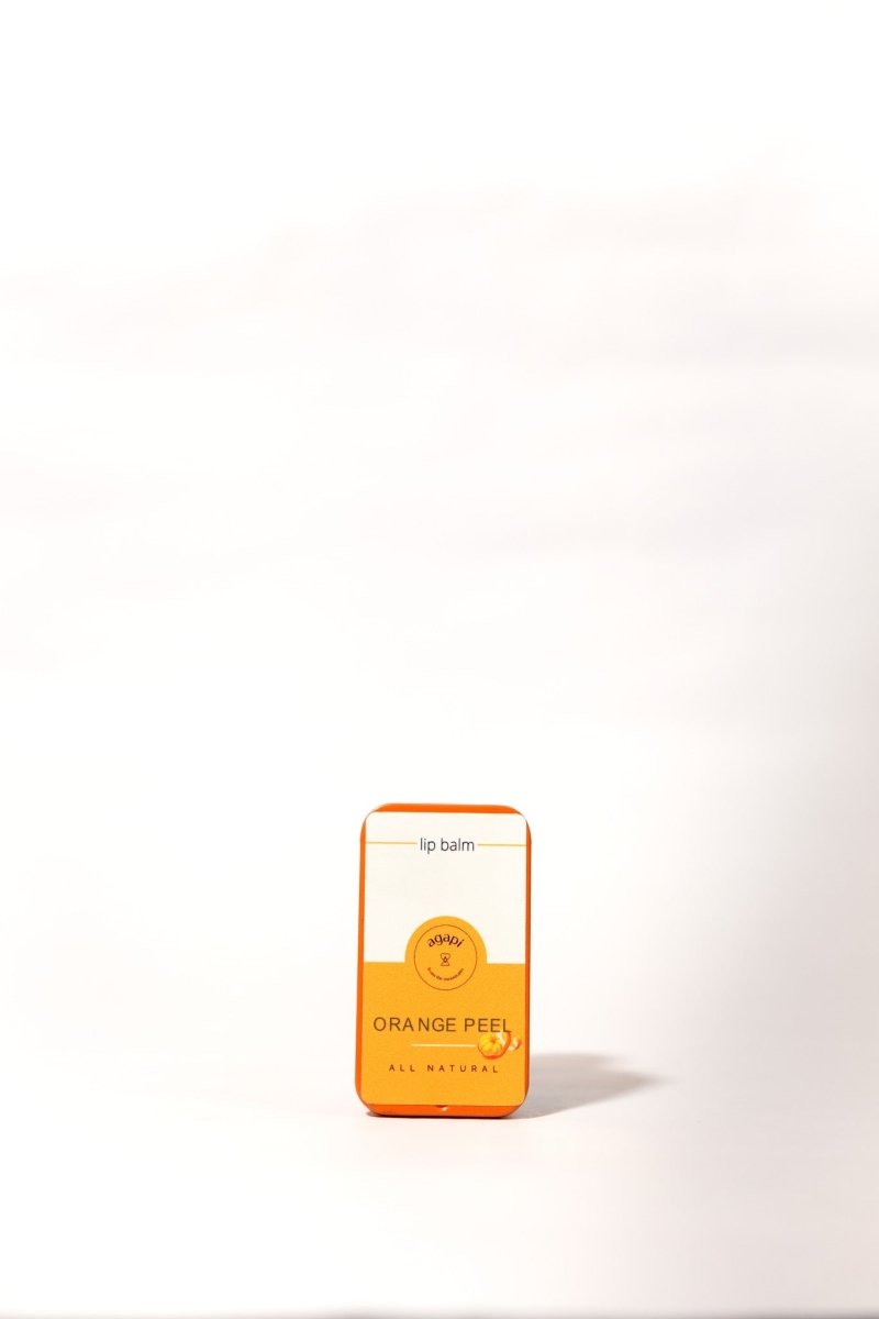 Natural Lip Balms – Hydrating & Healing Care – Skin Care by Agapi available on Brown Living™. Orange Peel . SKU: oceanblue - organic - cotton - shirt - 014480. Img 1.