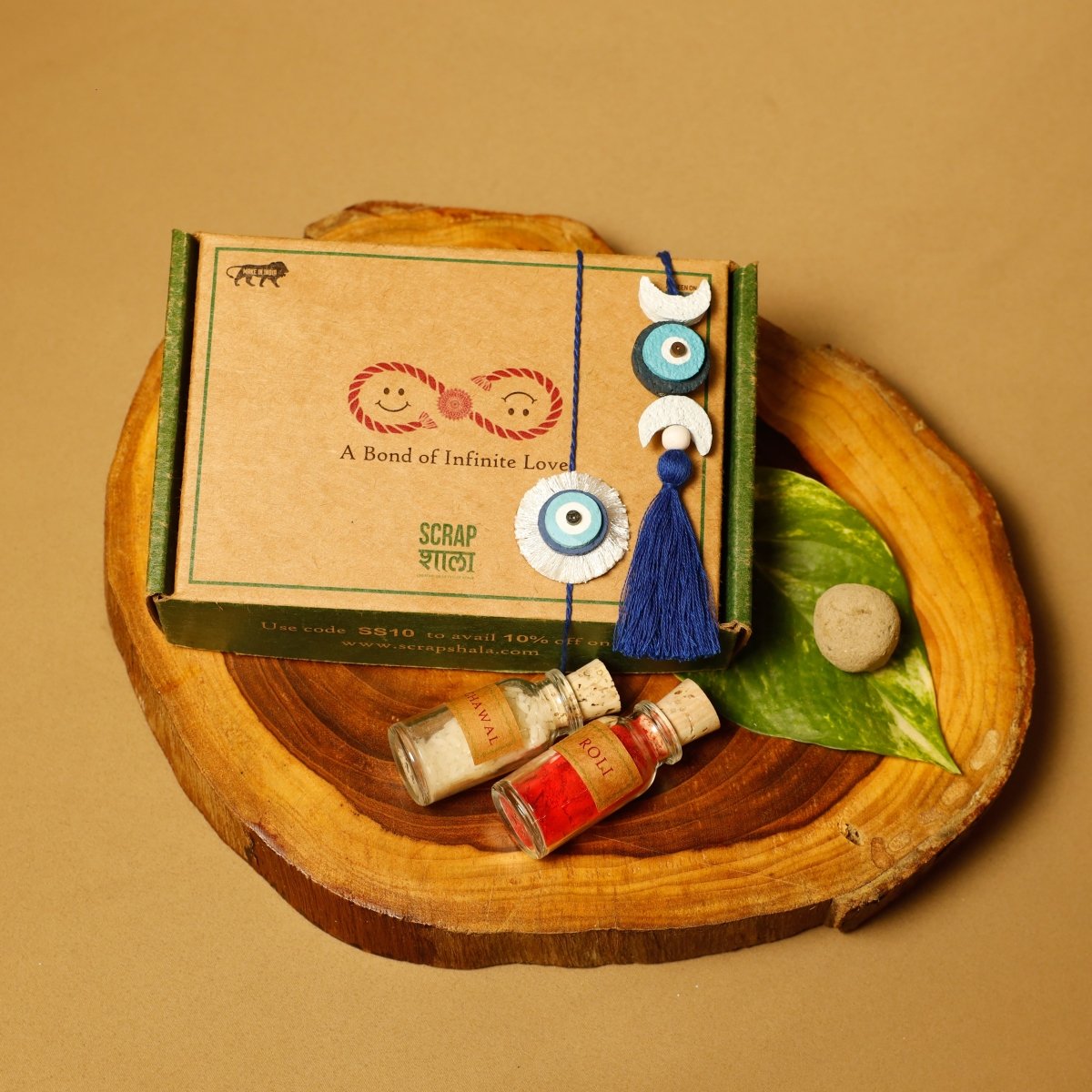 Nazarbattu Handmade Plantable Eco - friendly Rakhi Lumba Set with Roli - Chawal – Rakhi by Scrapshala available on Brown Living™. . SKU: SSR011. Img 1.