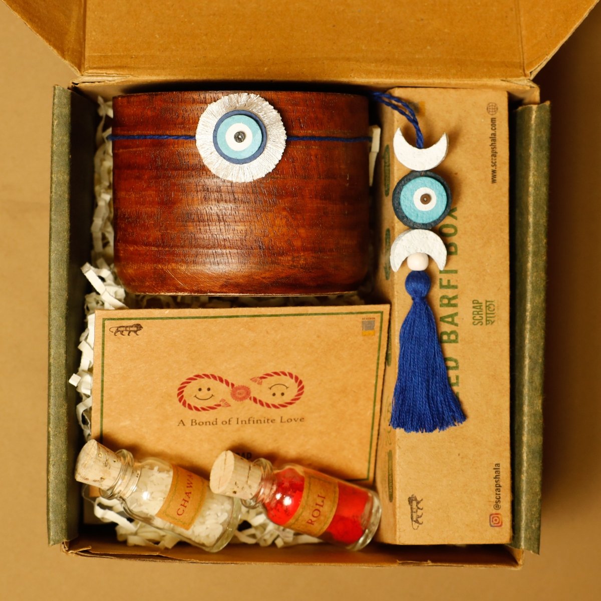 Nazarbattu Premium Rakhi Box | Handmade Plantable Rakhi and Lumba Set – Rakhi by Scrapshala available on Brown Living™. . SKU: SSR015. Img 1.