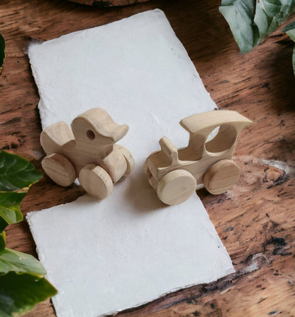 Pack Of 2 Beautiful Neem Wooden Wheel Toys – Train & Duck Shapes – Toy Trains & Vehicles on Brown Living™. SKU: W_TRN-DK. Img 2.