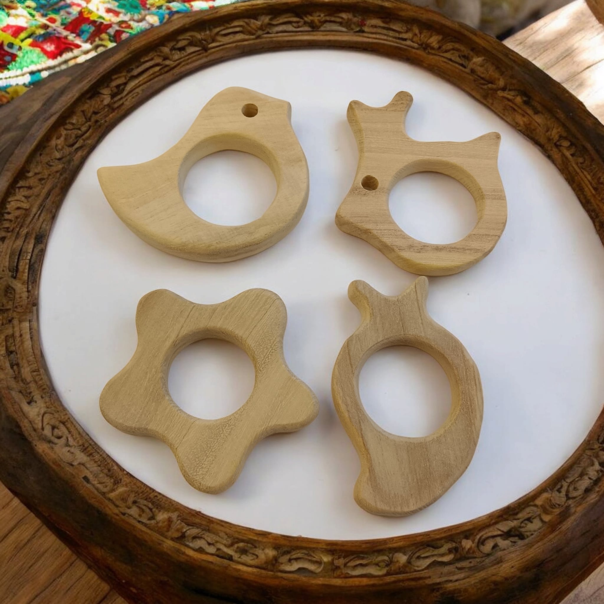 Pack of 4 Neem Wooden Teethers - Rabbit, Flower, Dove & Mango Shapes – Baby Teethers & Soothers on Brown Living™. SKU: T_RBT-FLR-DV-MNG. Img 5.