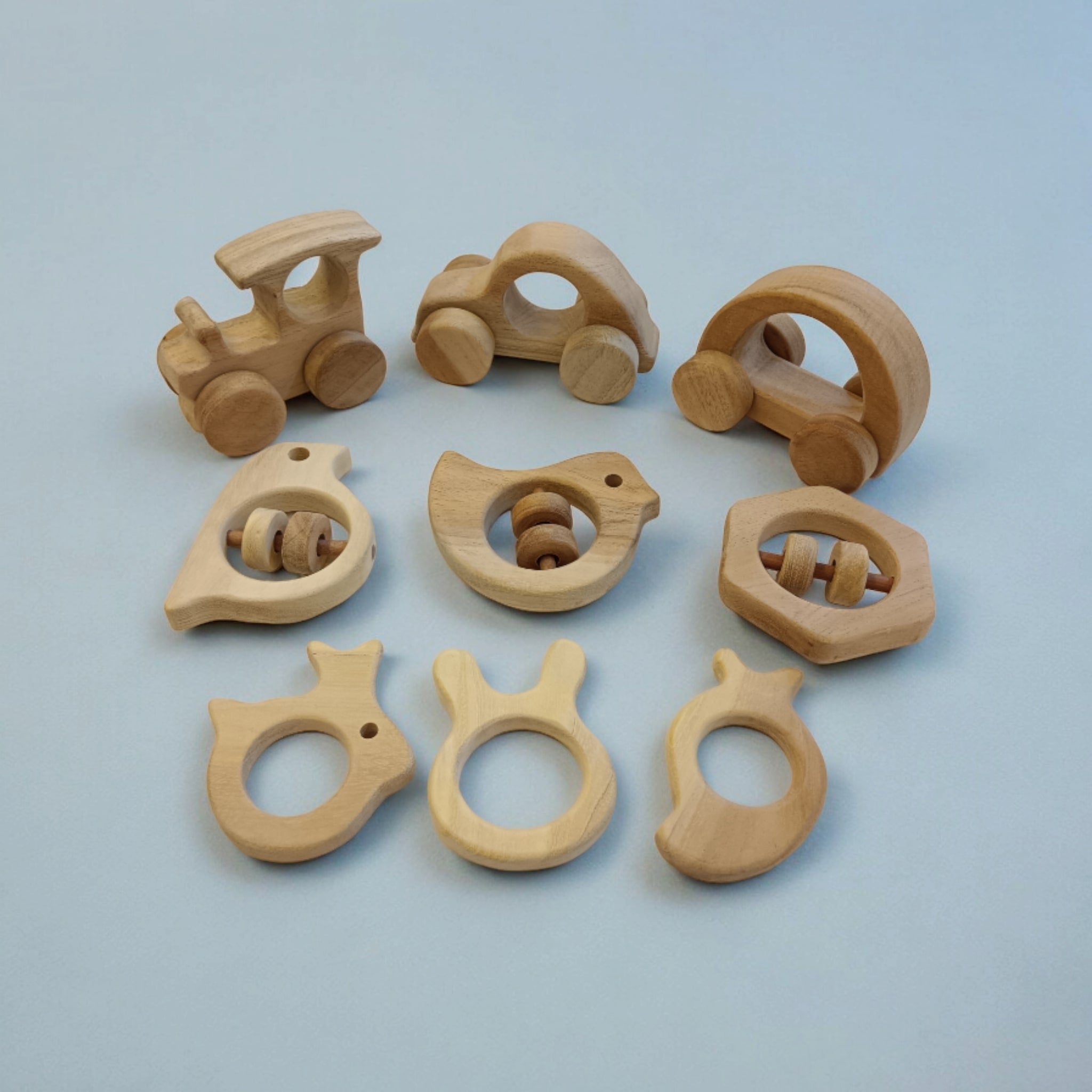 Pack of 9 Neem Wooden Baby Toys | Wheel, Rattle & Teether Set – Wooden Toys on Brown Living™. SKU: WRT_CR-HCR-TRN-DV-SPR-HXN-MNG-RBT-BNY. Img 1.